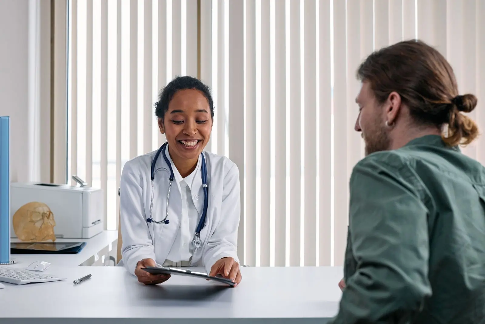 A doctor talking a patient through their results