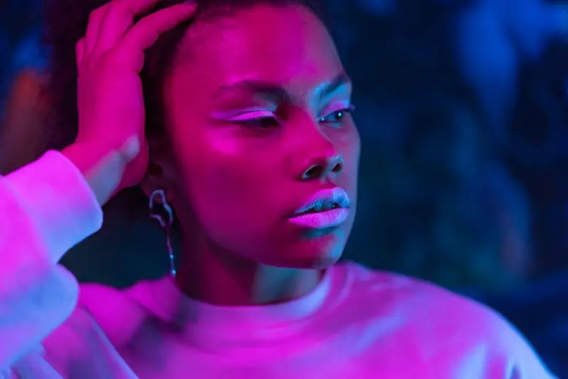 Afia Boateng, head of sound, lit in magenta