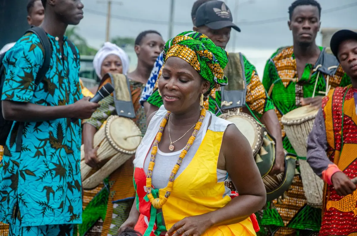 Performers in traditional dress at a West African cultural celebration