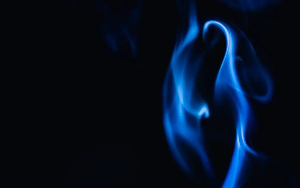 Blue smoke curling on black, the sleeve of the album Midnight Trotro