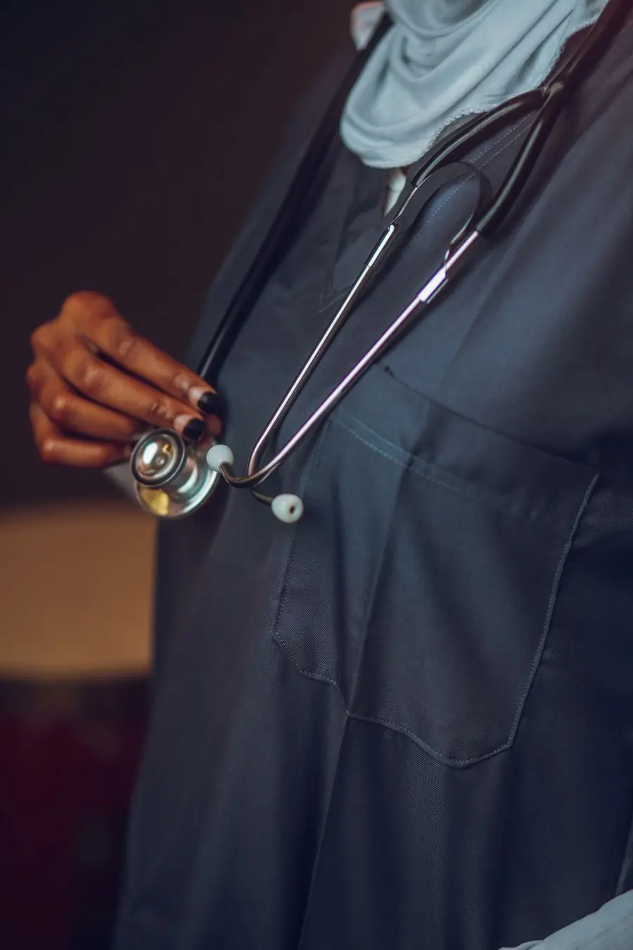 A doctor with a stethoscope on the ward